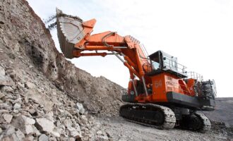 Hitachi divests half of stake in Hitachi Construction Machinery